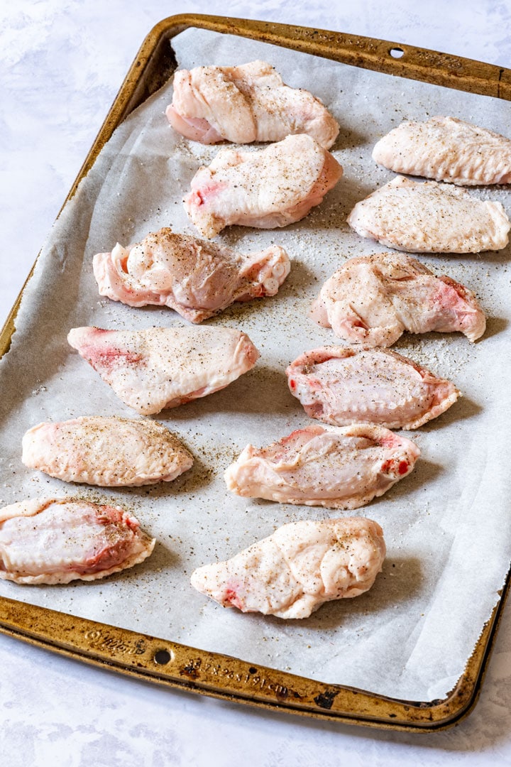 Uncooked chicken wings on the baking tray