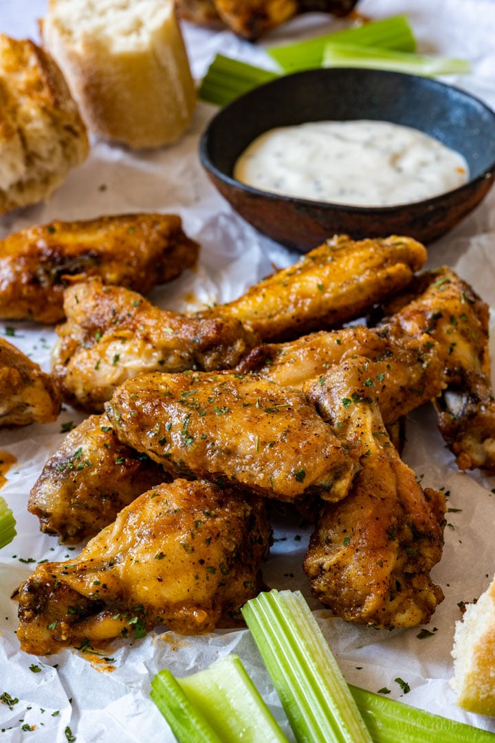 Garlic parmesan wings served with bread and garlic sauce