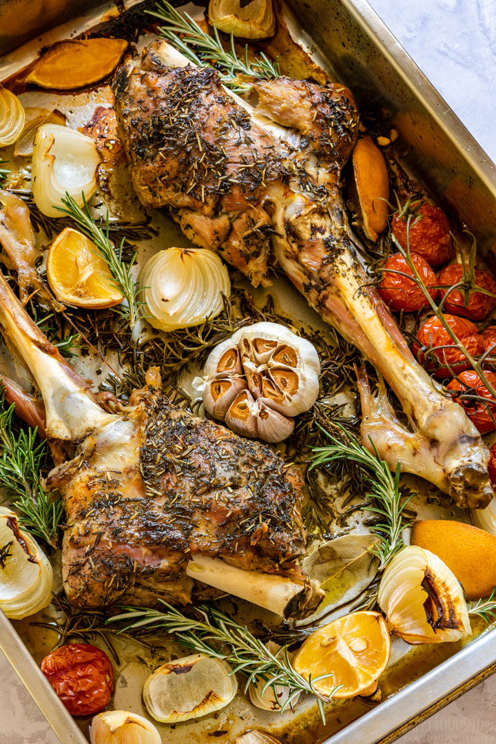 Oven roasted legs of lamb on the baking tray