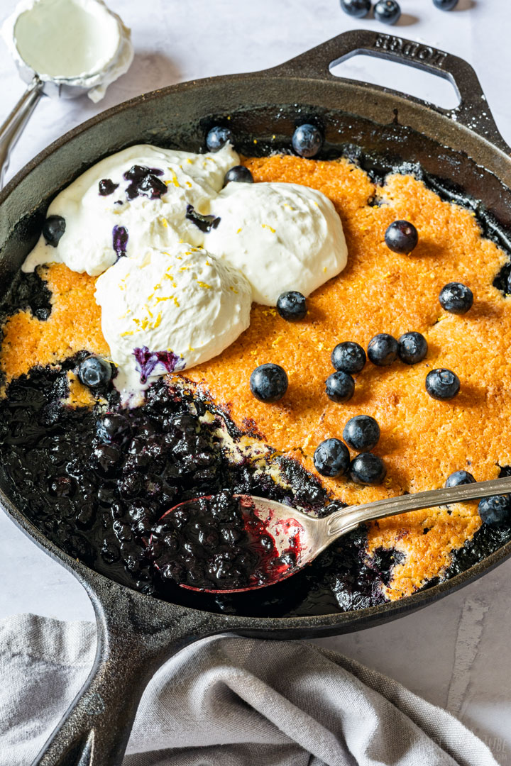 Homemade blueberry cobbler with a scoop of vanilla ice cream
