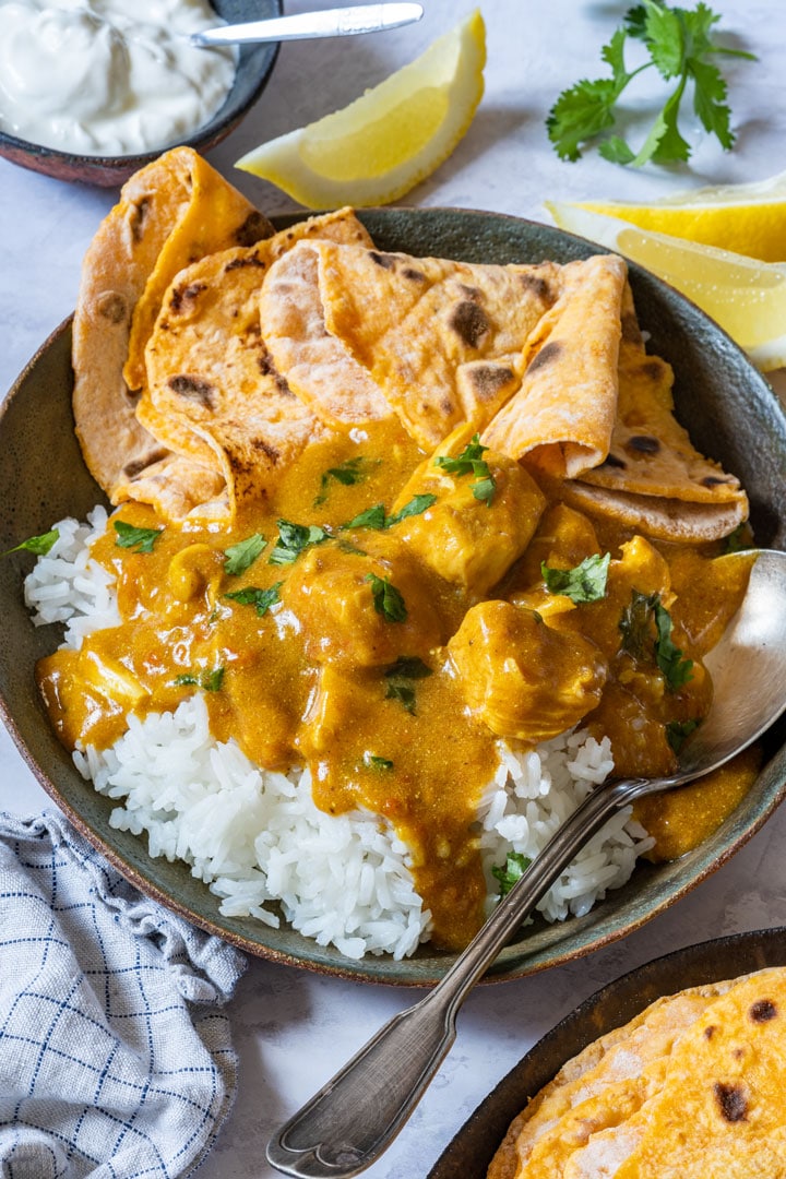 Bowl of chicken tikka masala with rice