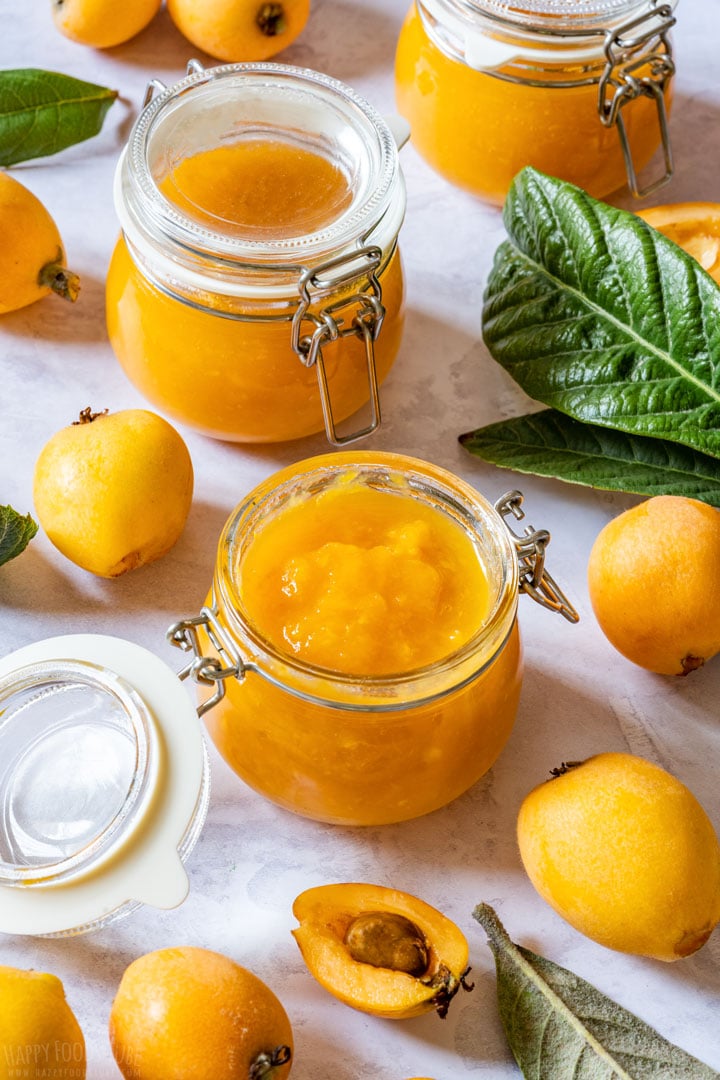 Homemade loquat jam jars with fresh loquat fruits