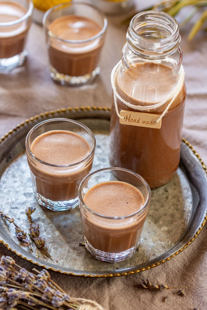 Small glasse filled with creamy caramel liqueur