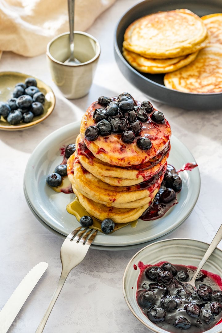 Stack of pancakes with homemade blueberry jam