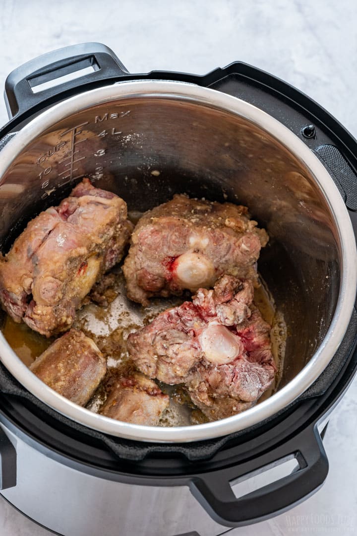 Browning the oxtails.