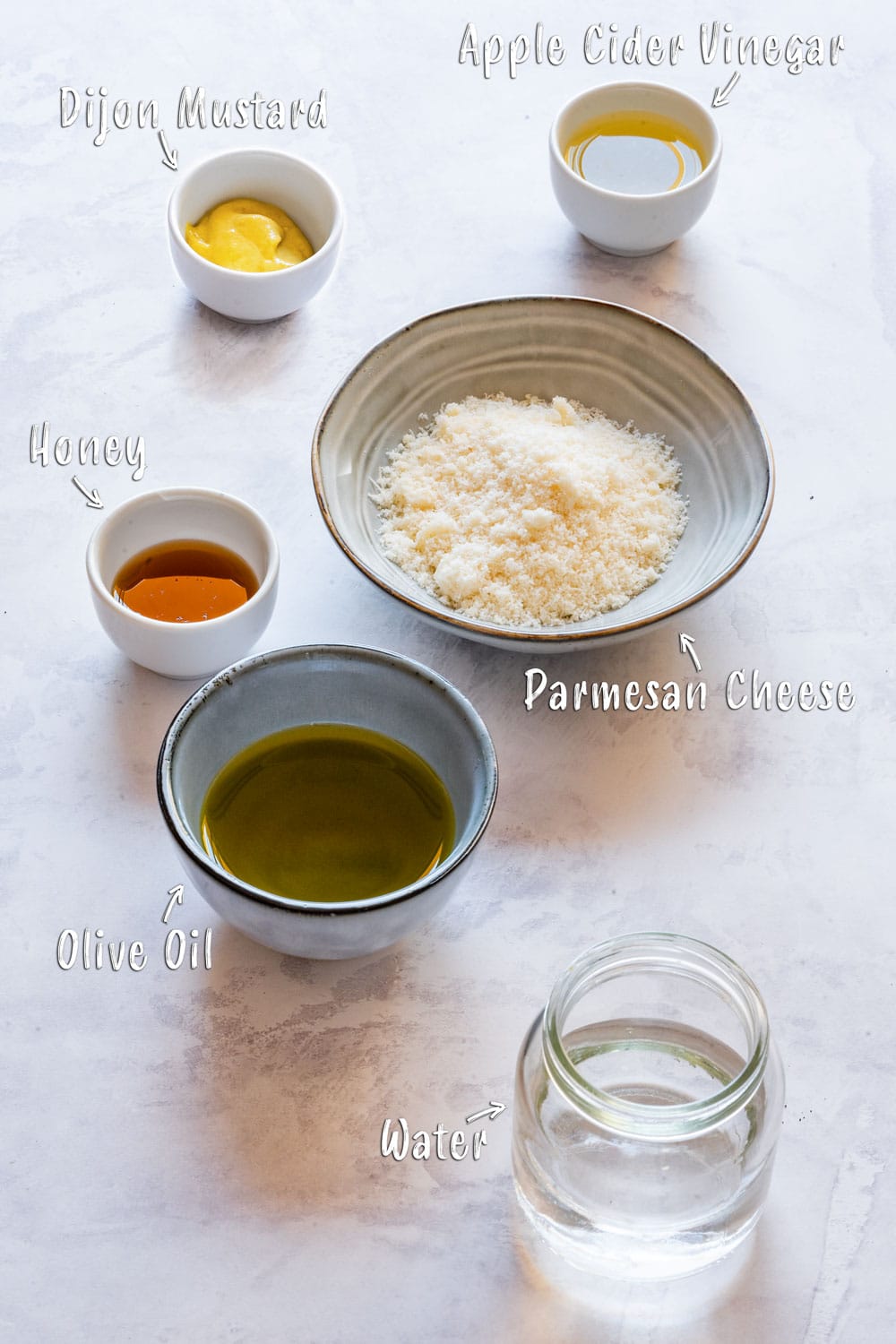 Parmesan vinaigrette ingredients on the table.