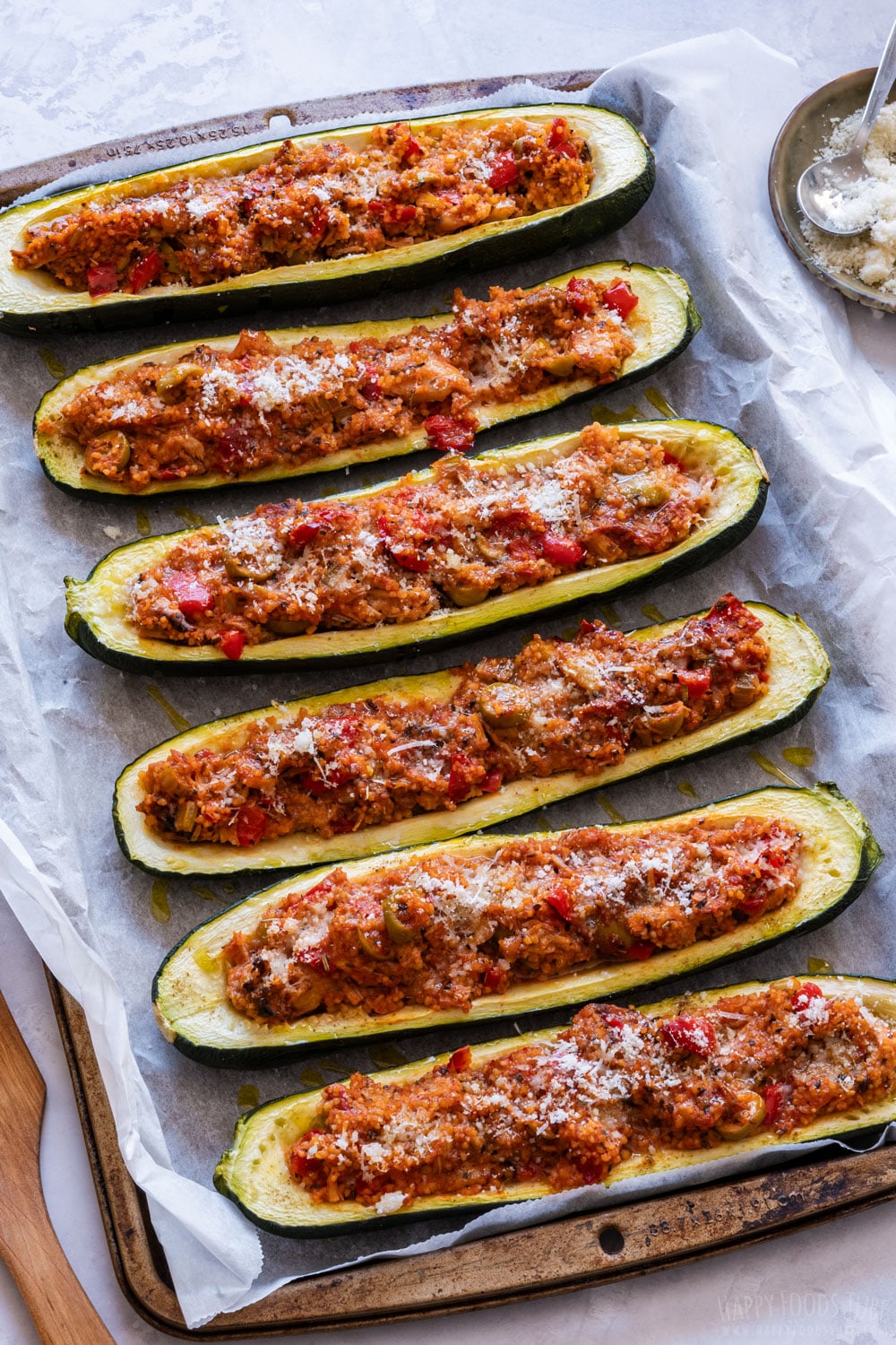 Cooked zucchini boats on the tray.
