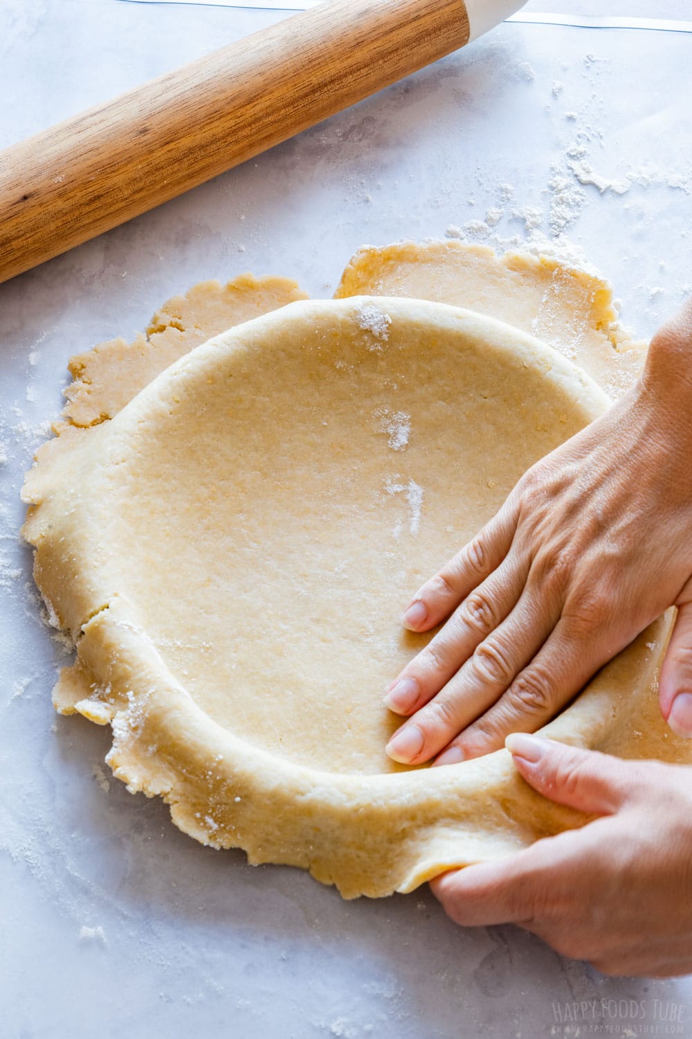 Prepare apple pie base pressing shortcrust pastry down.