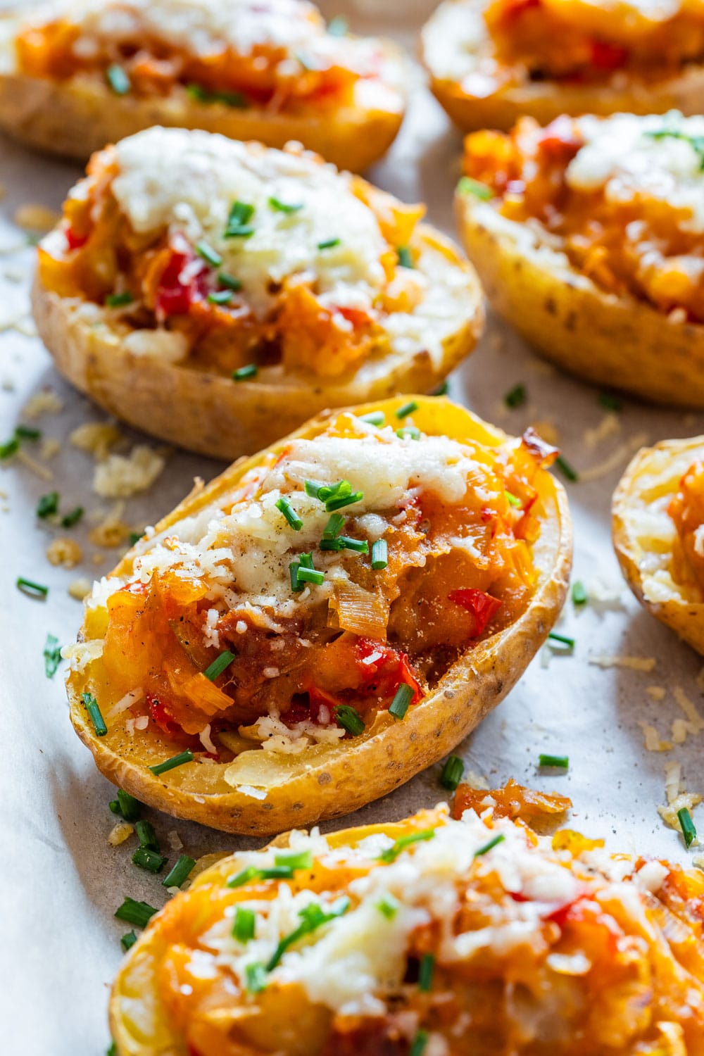 Twice baked potatoes topped with cheese.