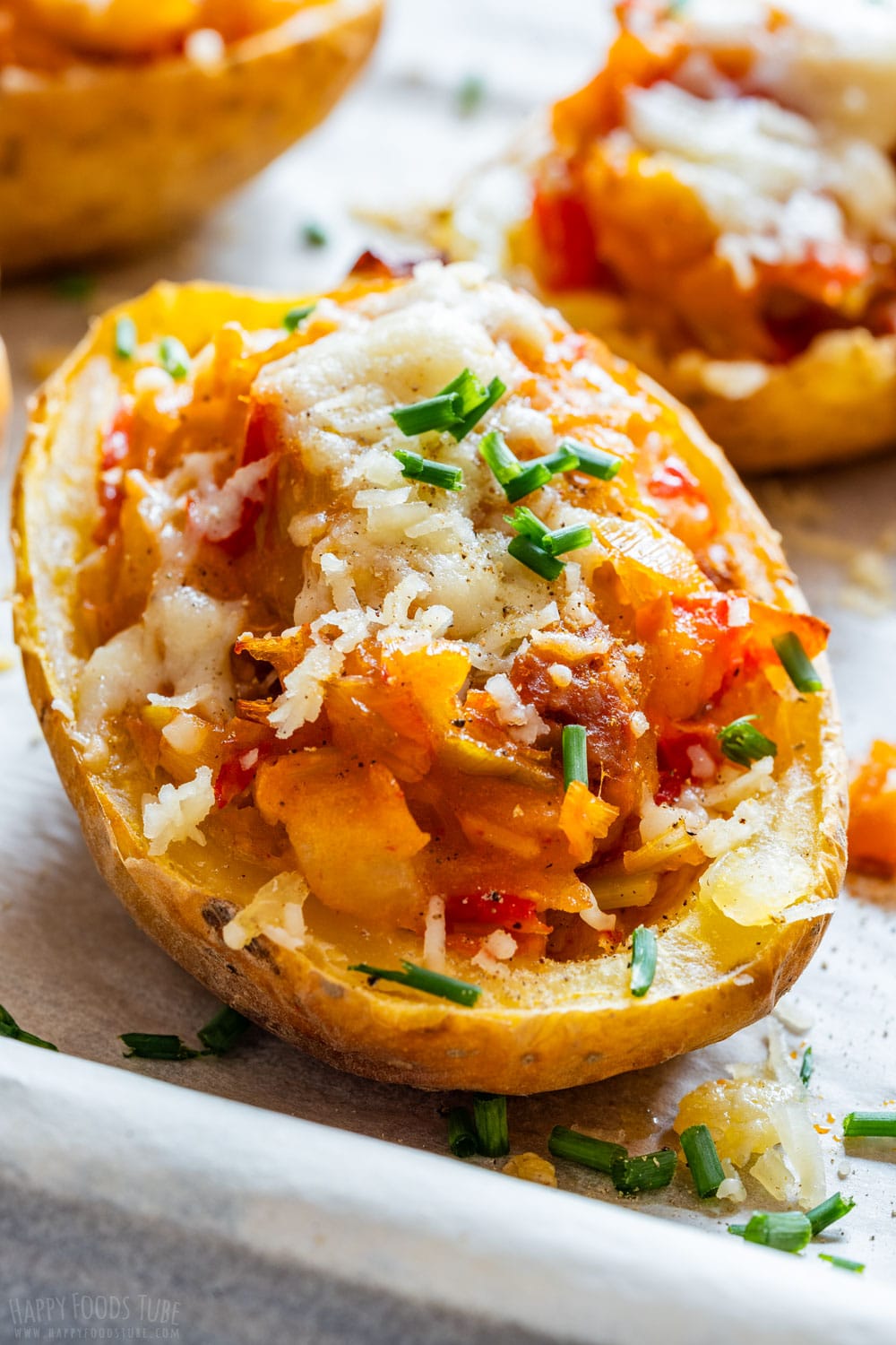 Twice baked potatoes with chorizo and cheese.