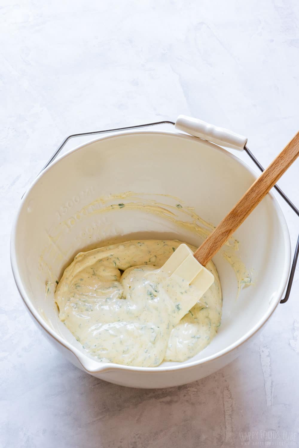 Creamy sauce in a large mixing bowl.