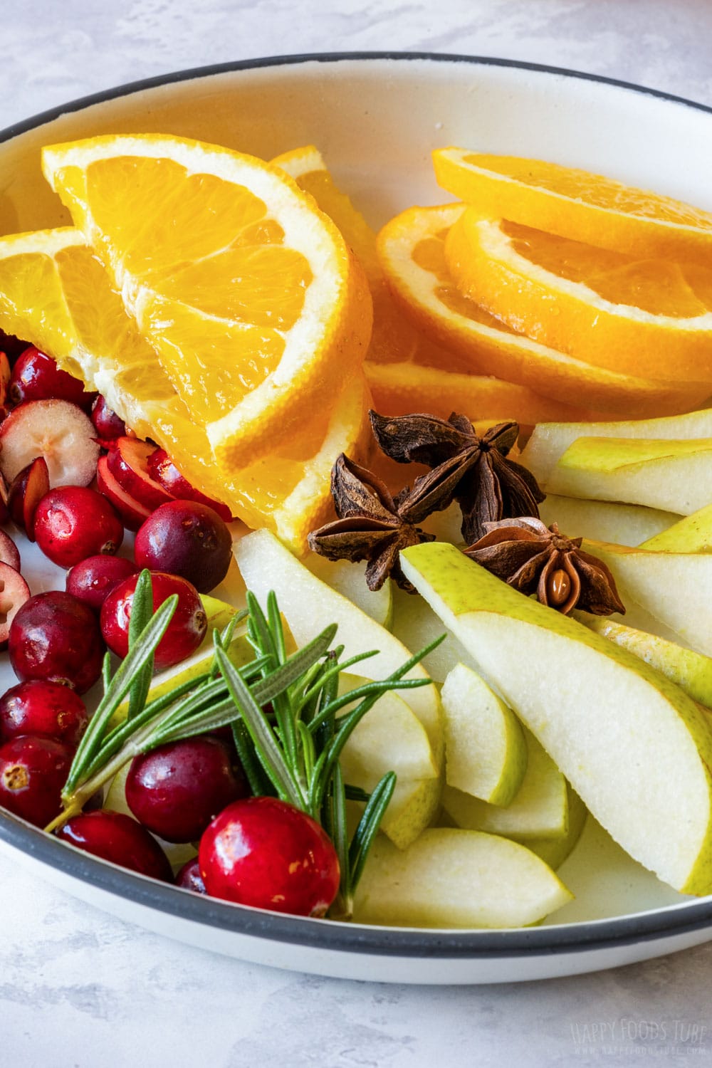 Fresh cranberries and sliced oranges, pears.