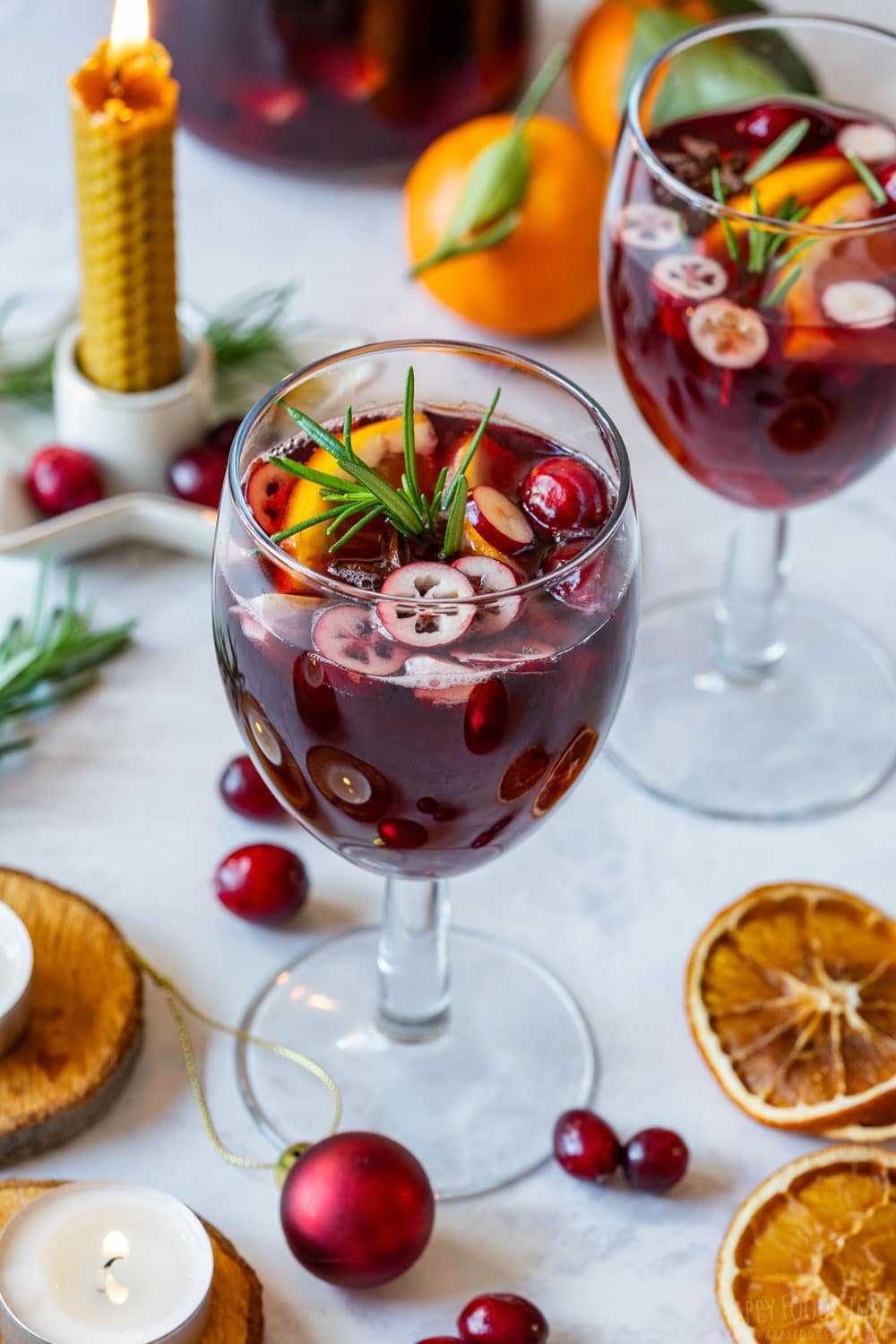 Fancy looking Christmas holiday sangria with fresh cranberries.