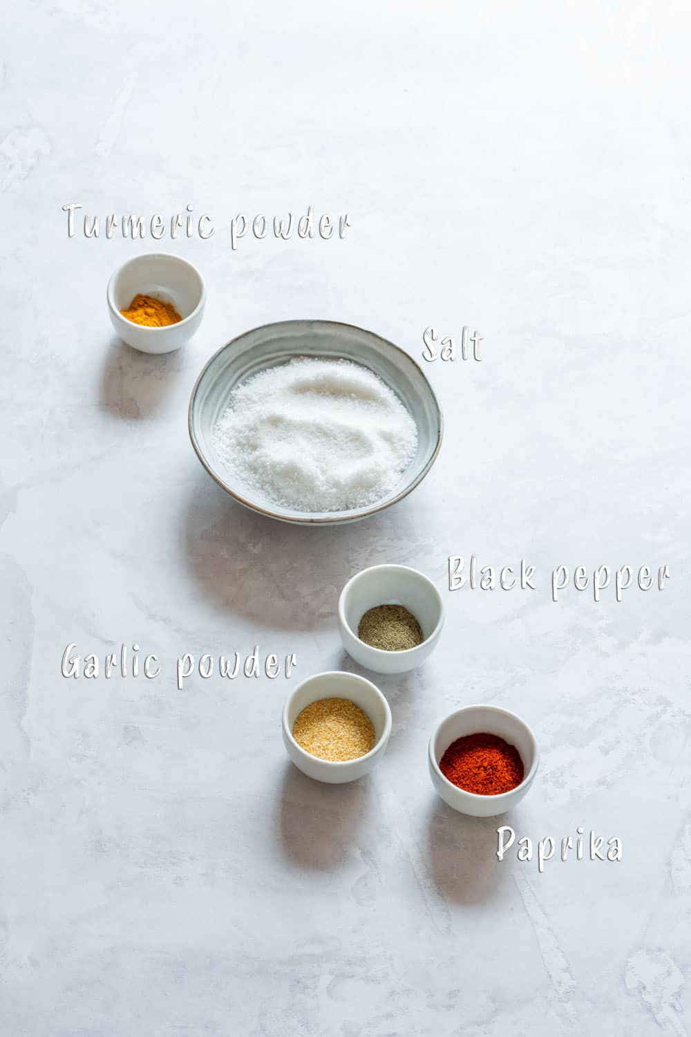 Ingredients of seasoned salt: salt, black pepper, garlic powder, turmeric and paprika.
