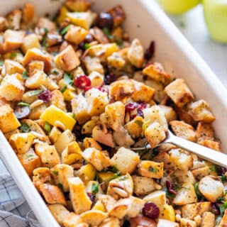 Holiday cranberry bread stuffing with apples and toasted pine nuts.