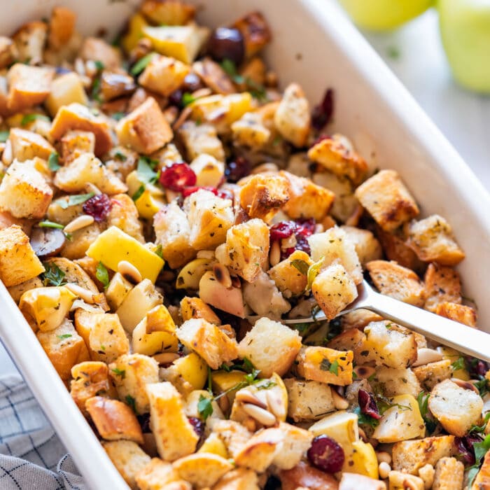Holiday cranberry bread stuffing with apples and toasted pine nuts.