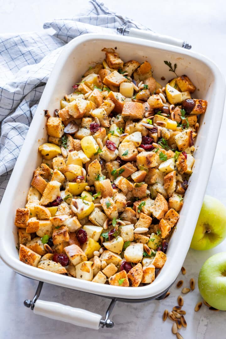 Freshly baked stuffing with apples, cranberries and pine nuts just out of the oven.
