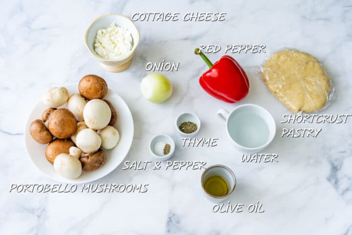 Ingredients for a savory galette, including mushrooms, red pepper, onion, cottage cheese and pastry dough.