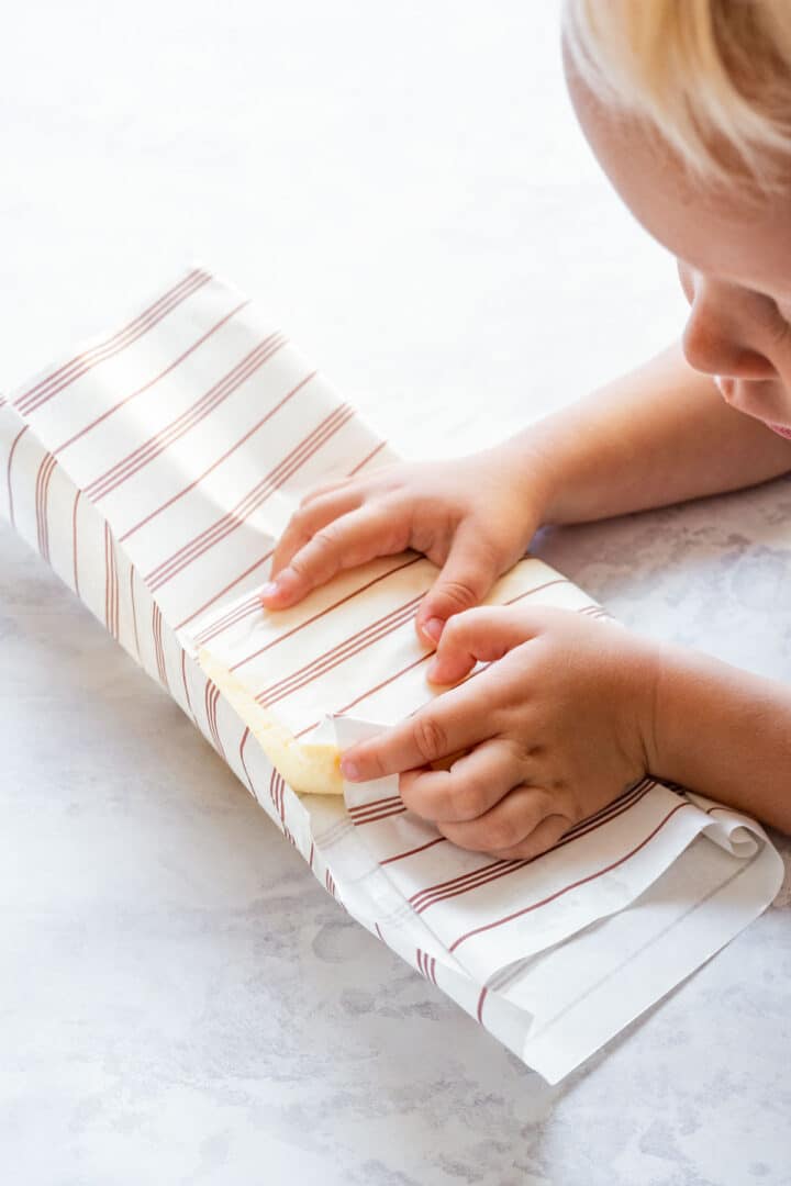 Wrapping freshly made butter in parchment paper.