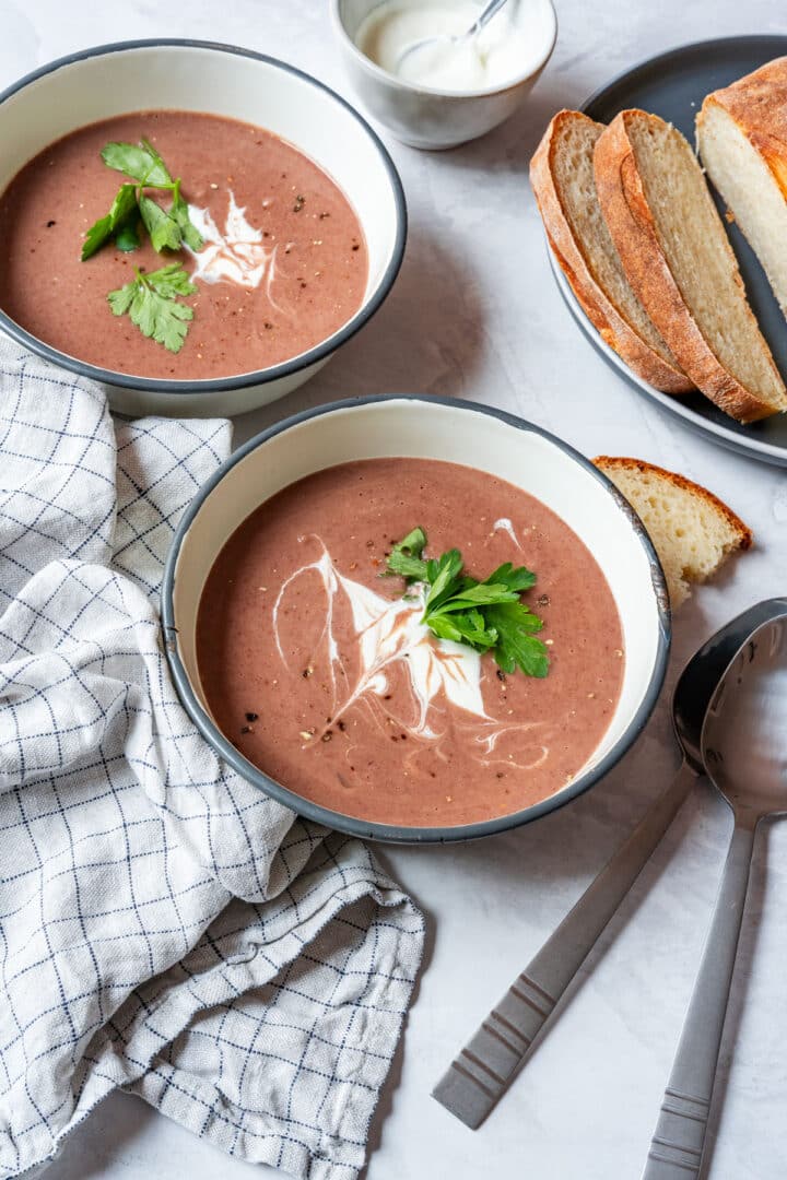 Red bean soup served with sliced bread and sour cream.