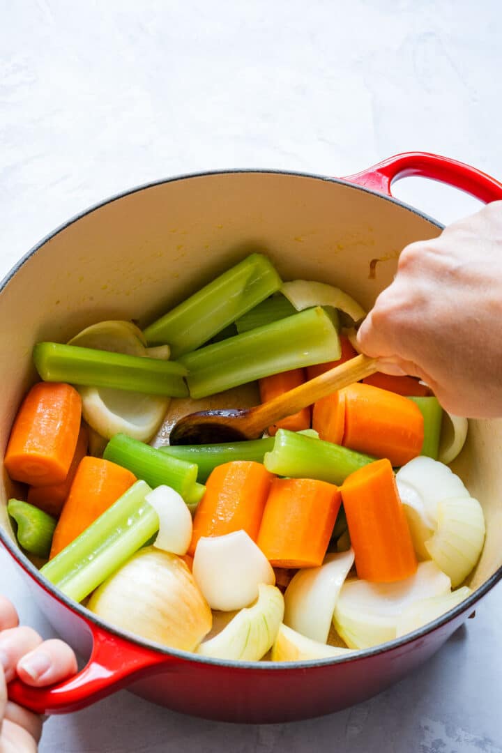 Sautéing onions, carrots and celery in a Dutch oven.