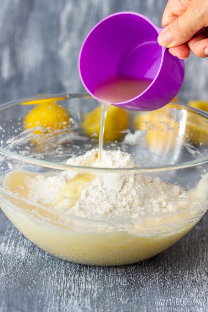 Adding fresh lemon juice to the cupcake batter.