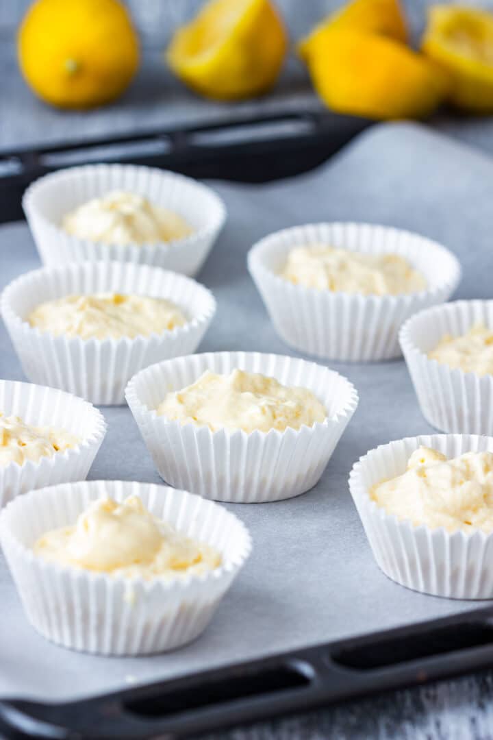 Cupcake liners filled with batter before baking.