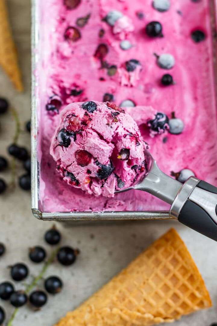 No-churn blackcurrant ice cream made with real berries, cream and Greek yogurt, no ice cream maker needed. Sweet, tangy and ready for the freezer in about 15 minutes. Fresh blackcurrants are hard to find in the US, so frozen work well for the cooked base. Save this for currant season.