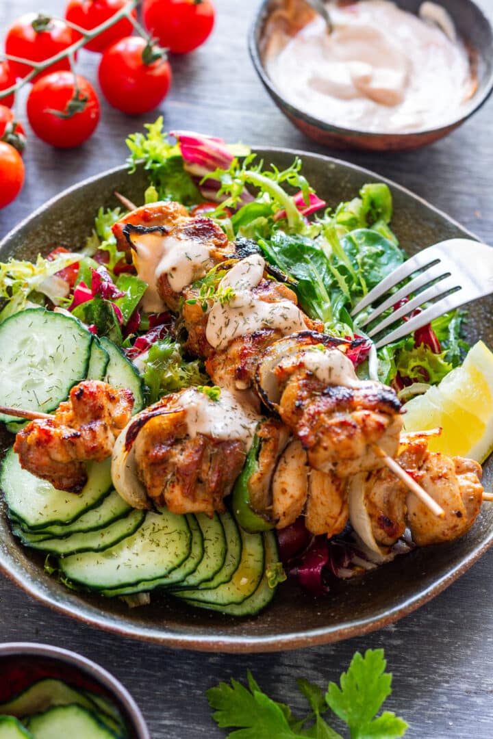 Grilled chicken kabobs made with chicken thighs, green pepper and onion in a lemony homemade fajita marinade. Grill them in about 15 minutes or use the oven for an easy summer dinner.