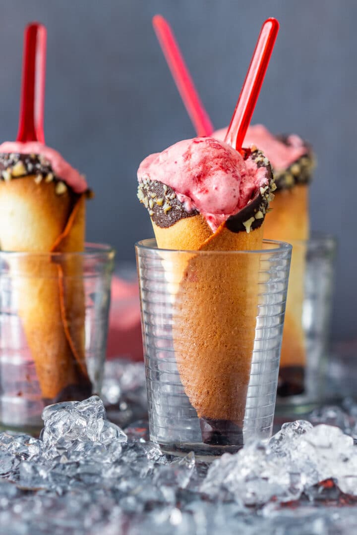 Homemade strawberry ice cream made with 3 ingredients, no ice cream maker and no condensed milk. Frozen strawberries, whipping cream and powdered sugar make soft serve in minutes, or freeze it for firm scoops.