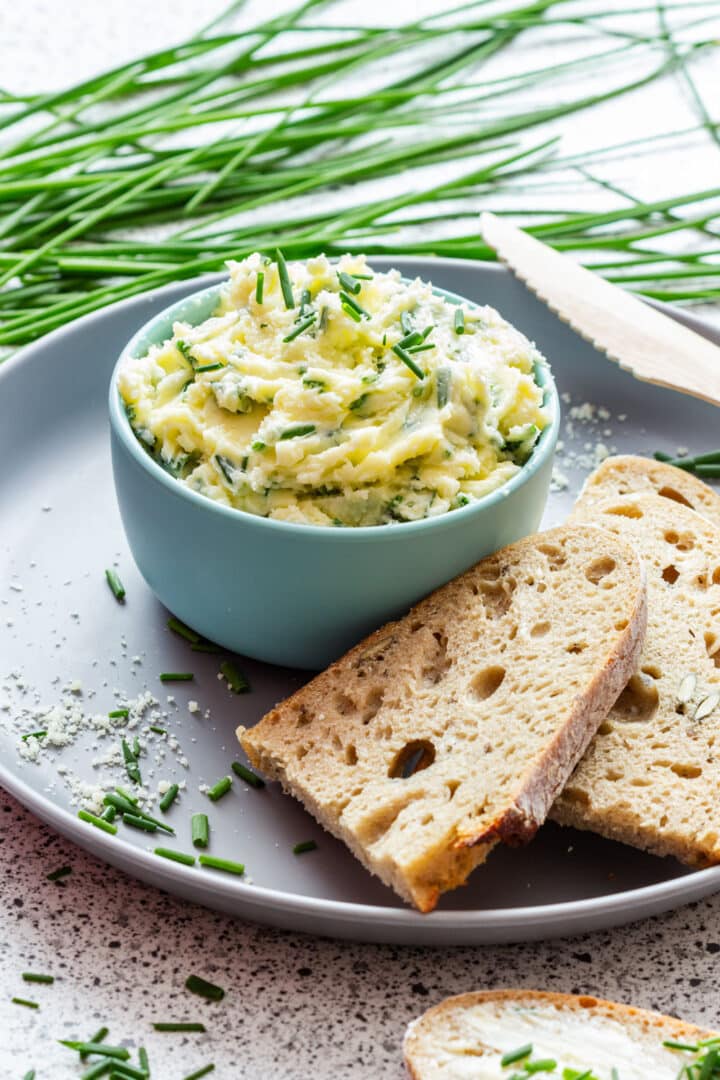 Parmesan chive butter made with just 3 ingredients in about 5 minutes. Spread it on sourdough bread or melt it over corn, potatoes, vegetables, steak or fish. This make-ahead compound butter keeps in the fridge for up to 1 week.