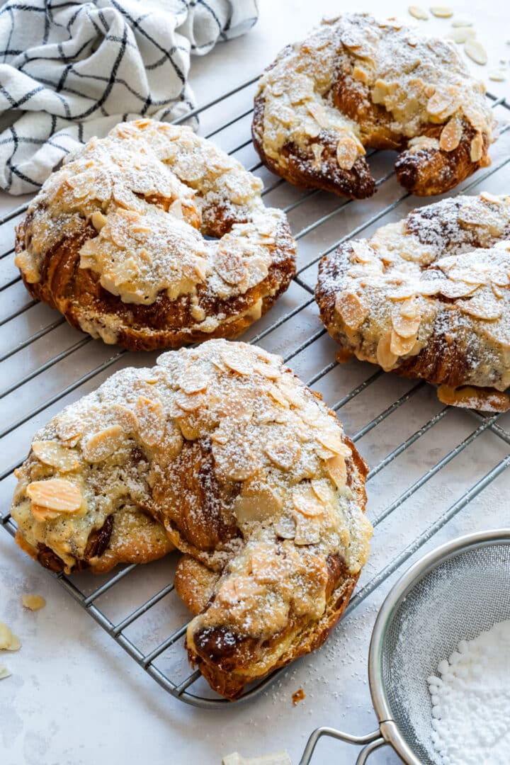 Store-bought croissants, fresh or a day or two old, become almond croissants with homemade frangipane spread inside and on top. I add a bit more sugar to the frangipane than in my pear tart, and use a little maple syrup instead of making simple syrup. Mix the filling the day before, then just assemble and bake in the morning.